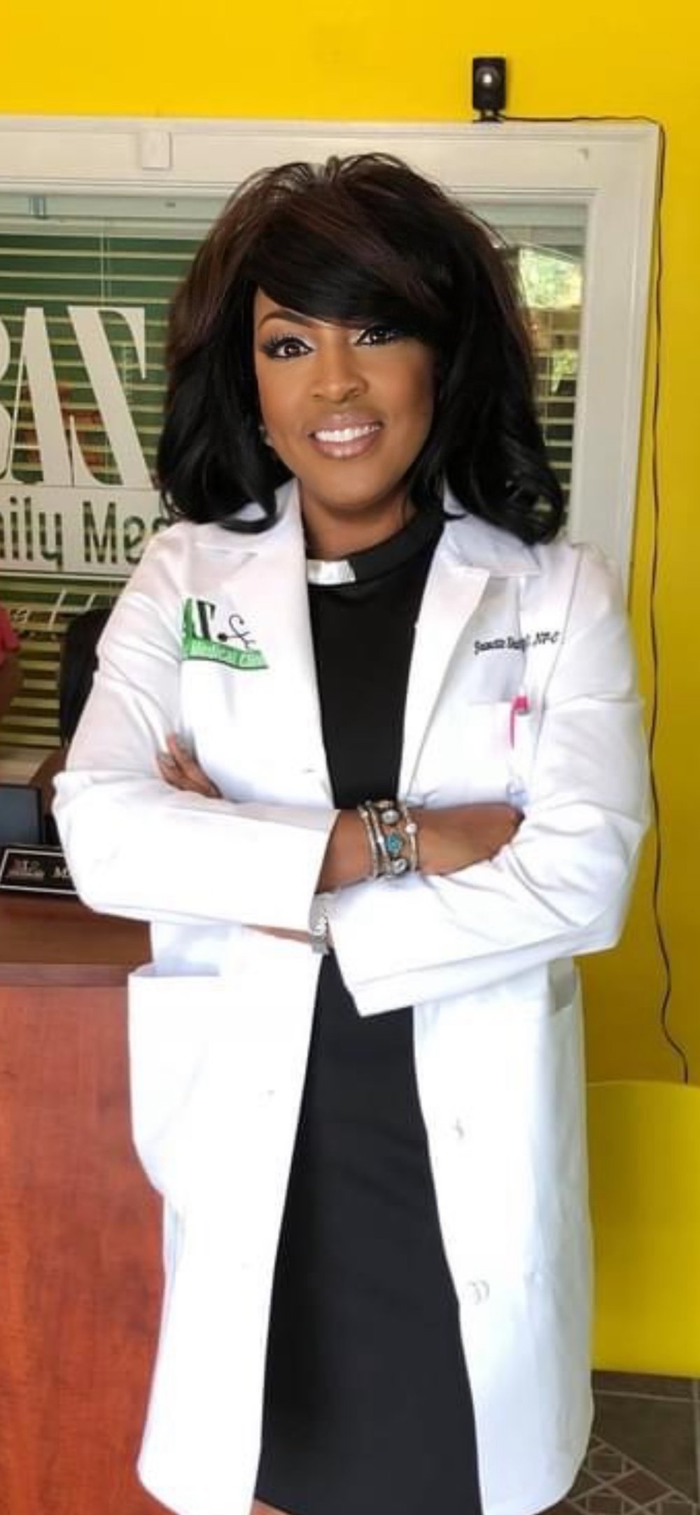 Dr. Jeanette Shabazz, PhD, NP-C, in her white coat at BAZ Family Medical Clinic
